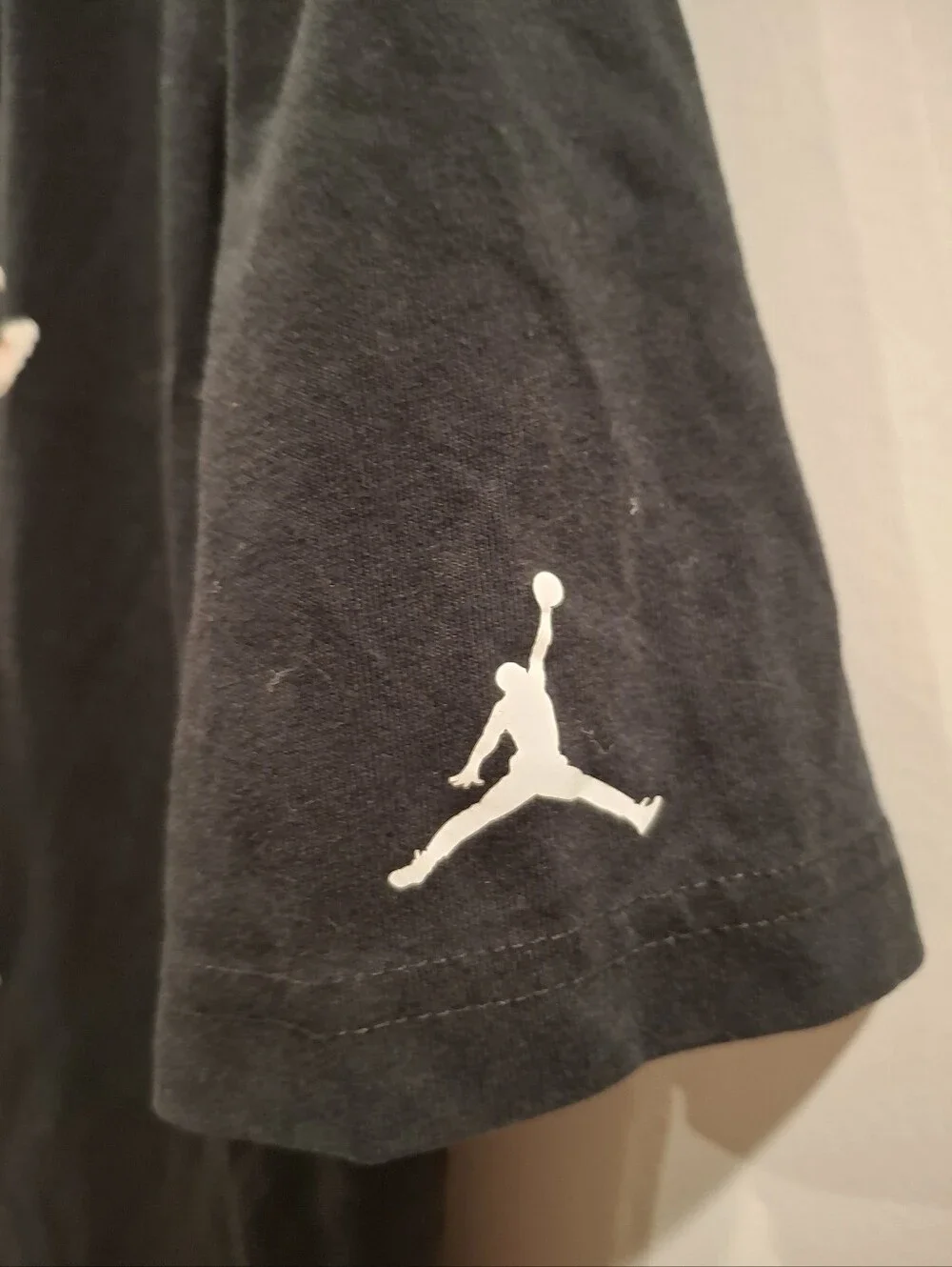 Jordan Black Tee with Goat Graphic and Red Jersey Detail